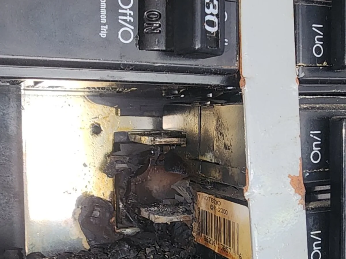 Burned circuit breaker connection requiring electrical repair