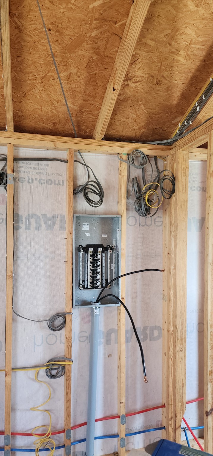Residential electrical panel with circuit wiring awaiting completion