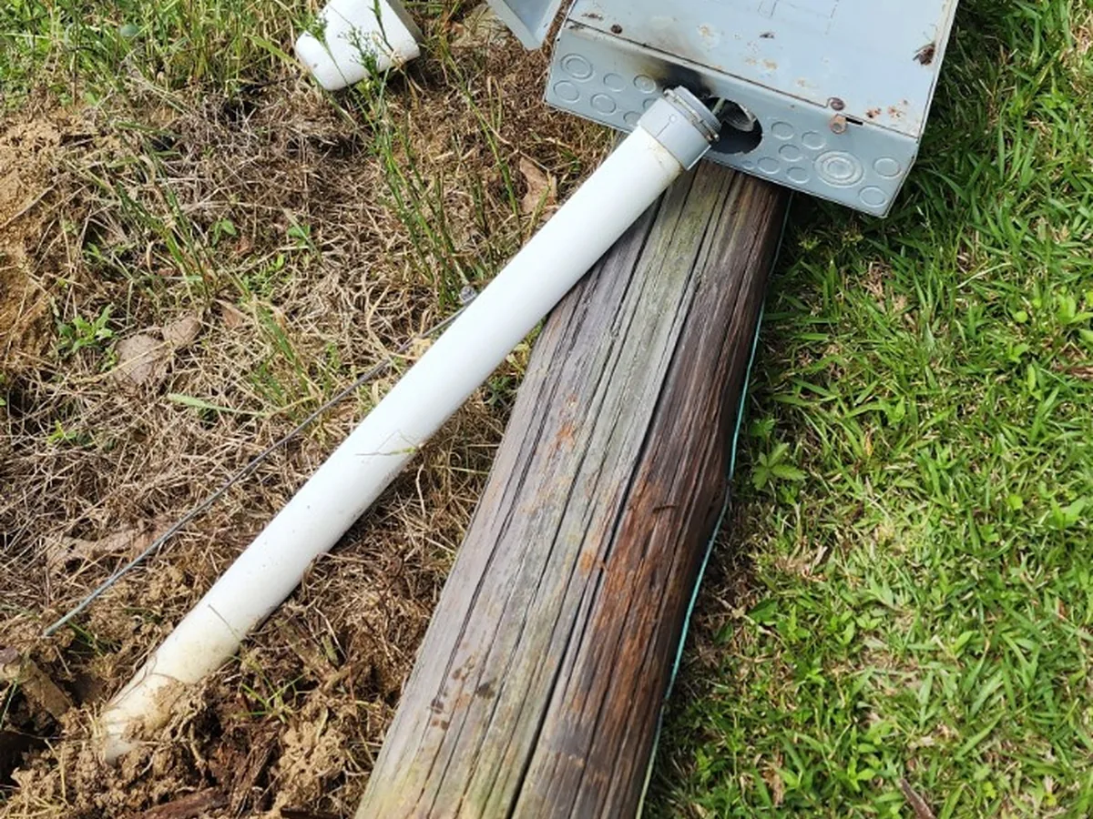 Storm-damaged electrical service pole and meter equipment